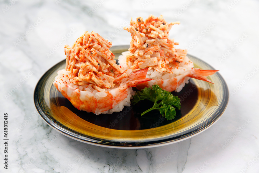 Freshly made Japanese food of shrimp sushi with kani salad Freshly made Japanese food of shrimp sushi with kani salad