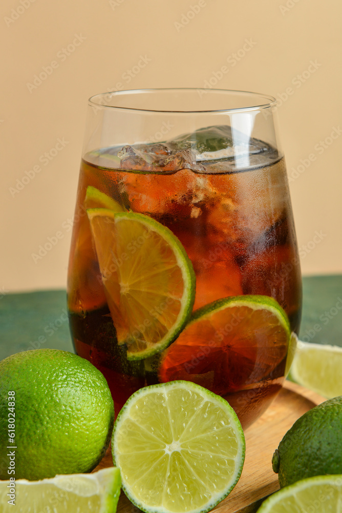 Glass of cold Cuba Libre cocktail on table Glass of cold Cuba Libre cocktail on table