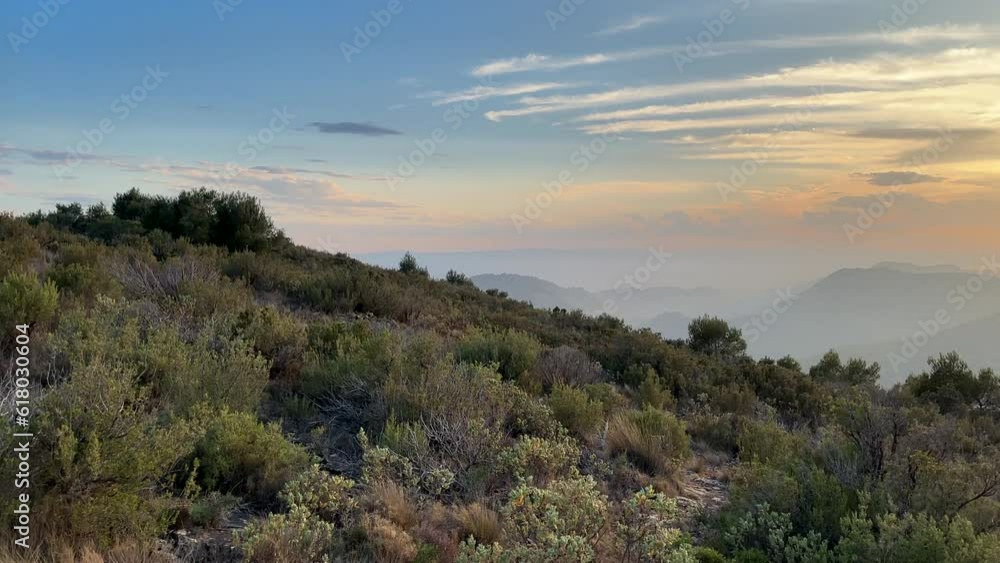 Mountains landscape on sunset. Mountain view from Mola De Segart mountain in Sierra Calderona national park in Valencia, Spain. Sunset over mountains. Landscape of a mountain valley. Hill on sunrise. Mountains landscape on sunset. Mountain view from Mola De Segart mountain in Sierra Calderona national park in Valencia, Spain. Sunset over mountains. Landscape of a mountain valley. Hill on sunrise.