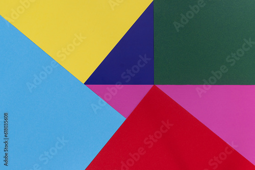 A background of six colors arranged at different angles. Abstract geometric background. A pattern of different colors. Overhead view