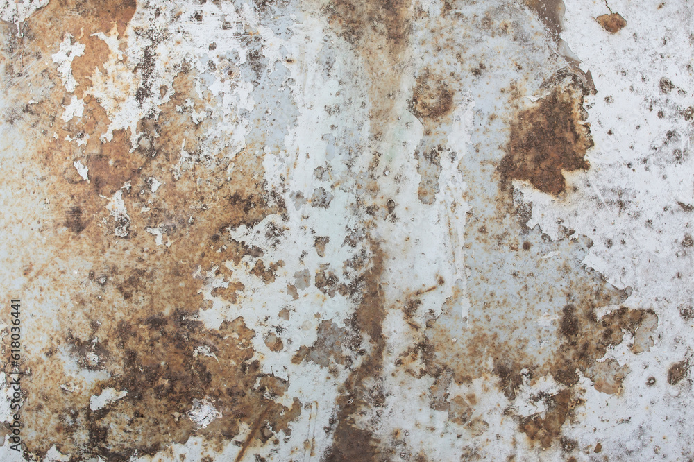 Rusty steel  plate with pealed white paint, weathered metal background
