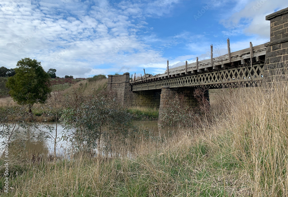 the old metal truss and bluestone bridge over Birch (Bullarook) Creek in Clunes, Australia the old metal truss and bluestone bridge over Birch (Bullarook) Creek in Clunes, Australia
