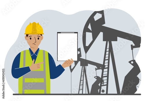 A male refinery engineer worker uses a tableted oil pumping unit. Energy industrial zone, oil drilling.