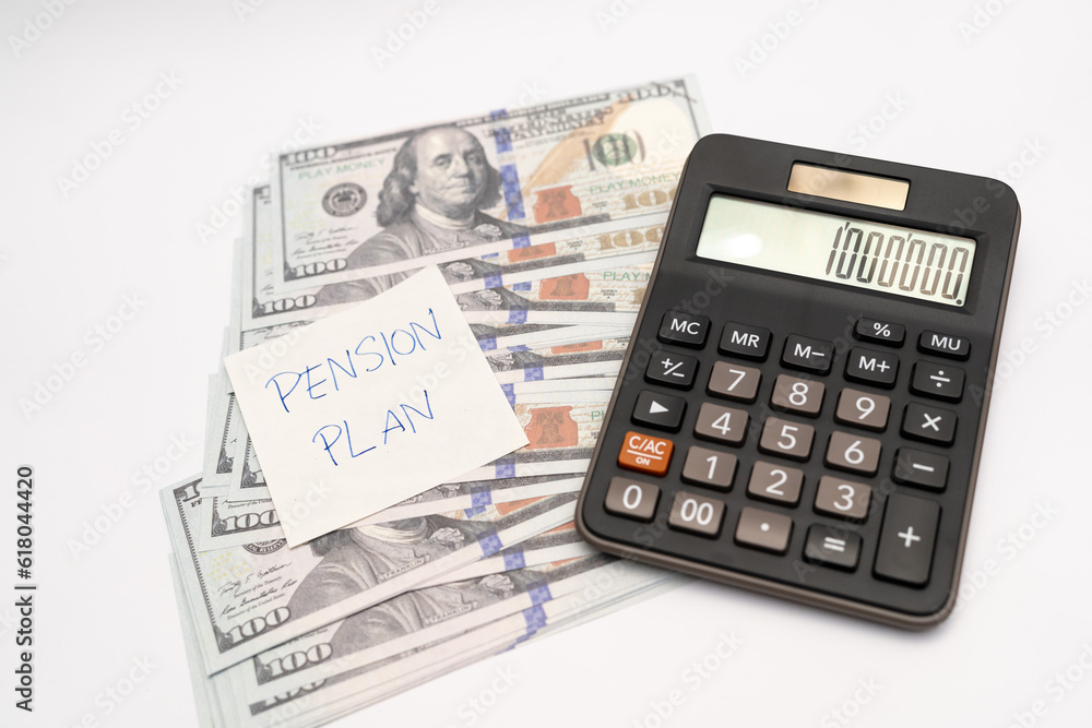Paper note with phrase Pension Plan, dollar banknotes, calculator. Retirement concept. Retirement saving and pension planning. Paper note with phrase Pension Plan, dollar banknotes, calculator. Retirement concept. Retirement saving and pension planning.