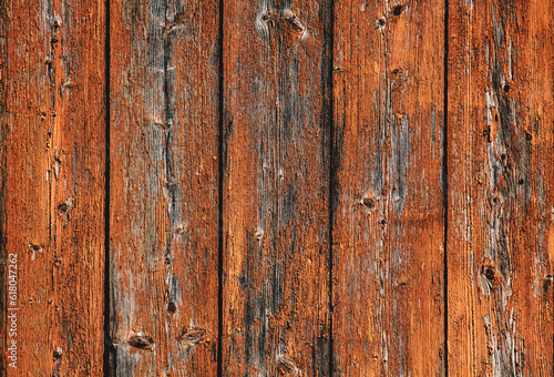 Wooden background boards. Old wooden fence painted in orange background. Backgrounds and texture concept © nblxer