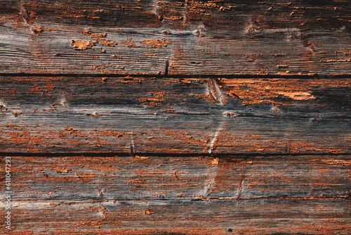 Wooden background boards. Old wooden fence painted in orange background. Backgrounds and texture concept