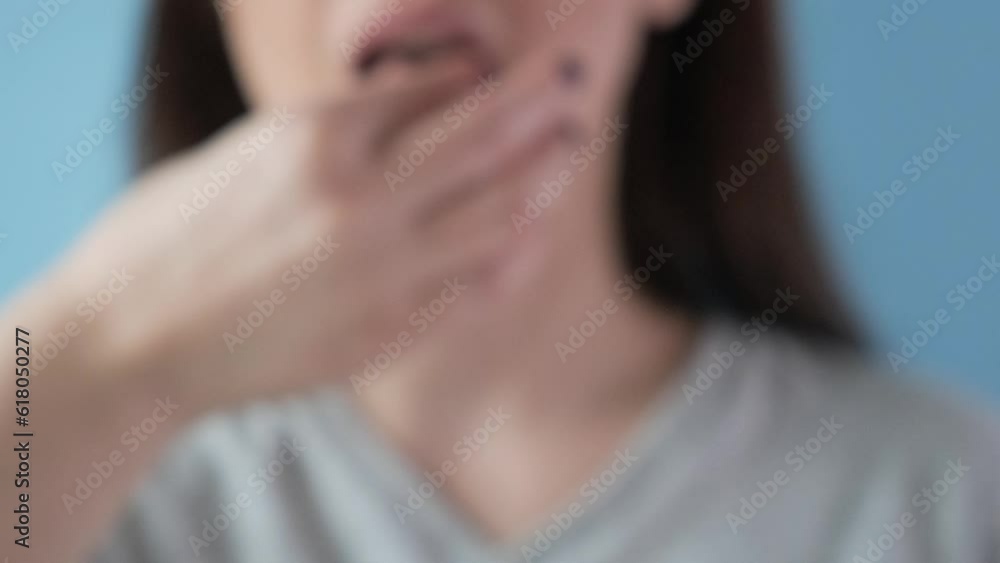 Woman taking white pill of statin medicine to treat high cholesterol or painkiller with glass of water. Taking medicine