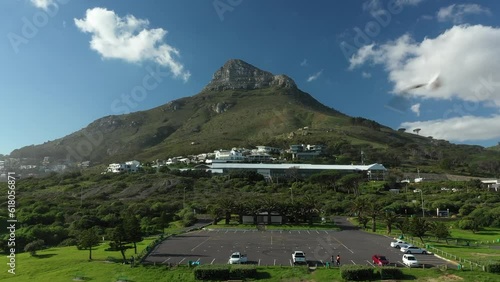 Aerial view of green parks with roads and Lions Head Mountain on the horizon in Cape Town