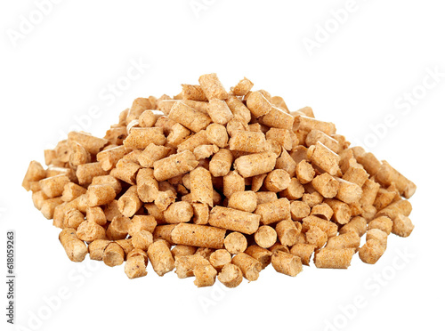 Pressed pellets of wood sawdust for a cat's toilet, piled up, isolated on a white background. Eco-friendly biodegradable product.