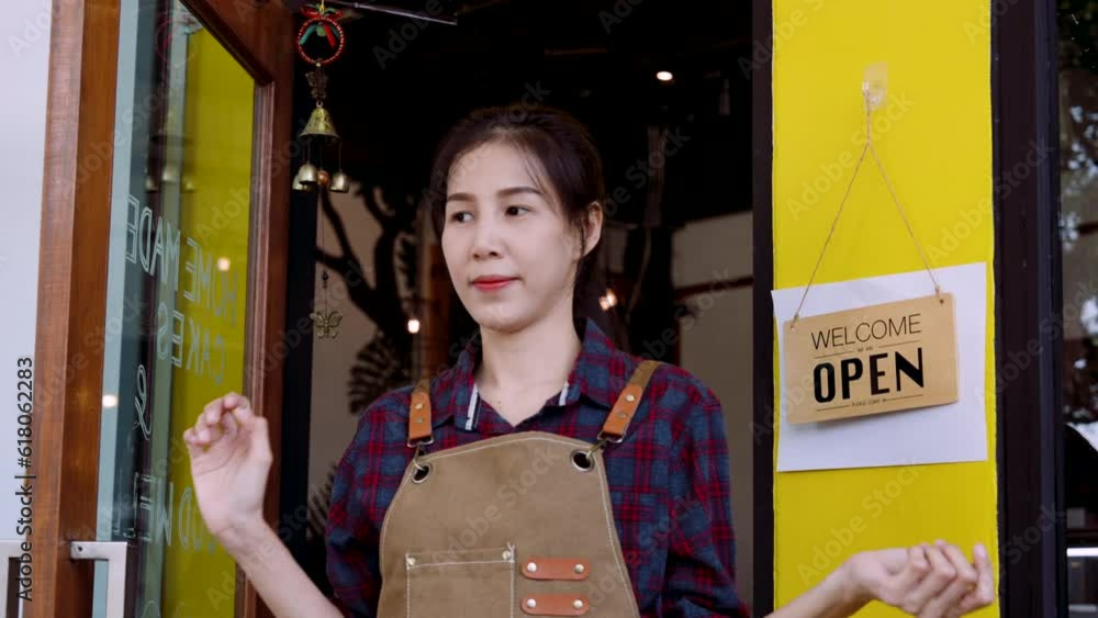 Portrait woman shop owner at bakery, woman walked out door switch closed sign open shop, so that regular customers passers-by know that shop is open, raised both arms crossed arms stood looking. Portrait woman shop owner at bakery, woman walked out door switch closed sign open shop, so that regular customers passers-by know that shop is open, raised both arms crossed arms stood looking.