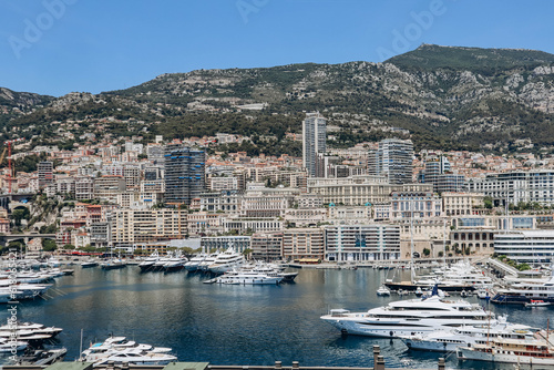 Fototapeta Naklejka Na Ścianę i Meble -  Monaco, Monaco - 25 June 2023: View of Port Hercule in Monaco on a sunny day