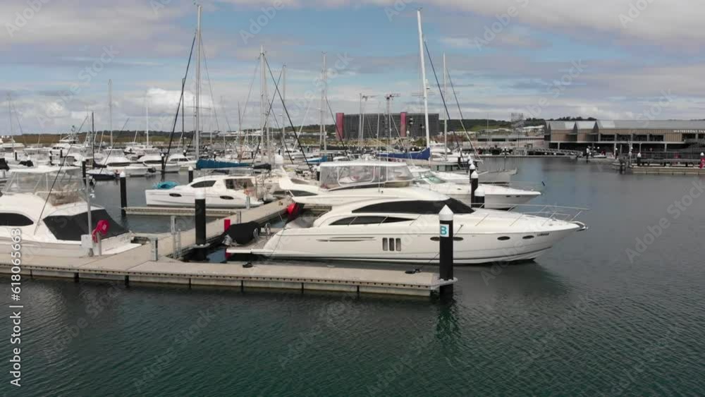 Aerial of boats parked on the pier with the cloudy sky in the background Aerial of boats parked on the pier with the cloudy sky in the background
