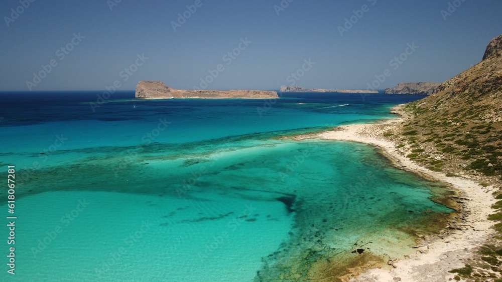 Tranquil bay with a rocky cliff in the background Tranquil bay with a rocky cliff in the background