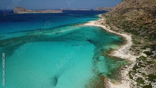 Tranquil bay with a rocky cliff in the background