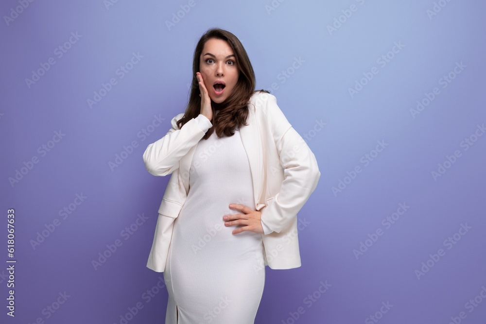 shocked surprised brunette business young woman in dress and jacket shocked surprised brunette business young woman in dress and jacket