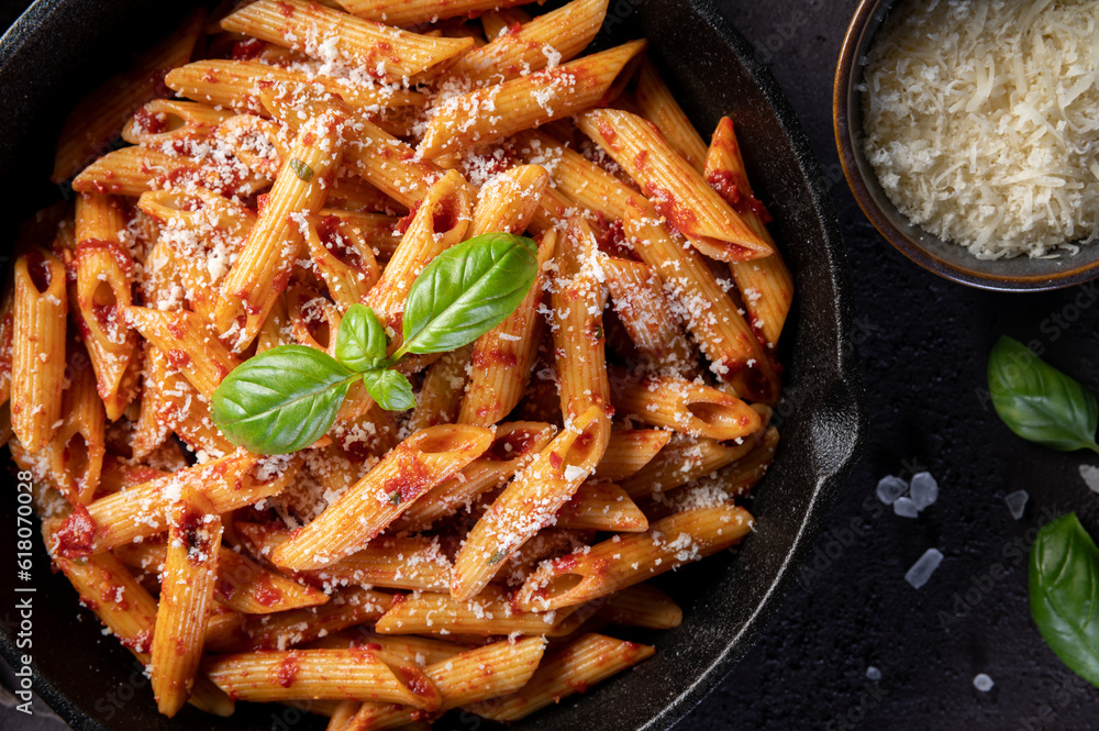 Penne Pasta with tomato sauce, parmesan and fresh basil in a pan. Top view, Penne Pasta with tomato sauce, parmesan and fresh basil in a pan. Top view,