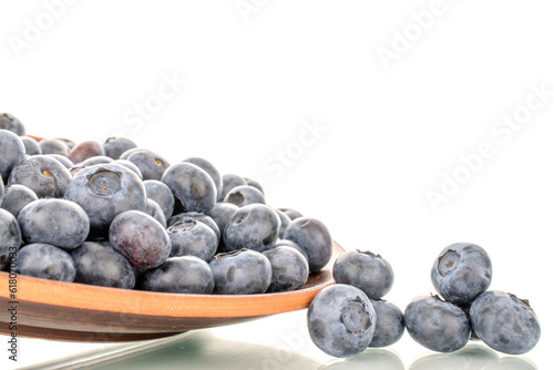 A few sweet blueberries with a clay plate  macro  isolated on a white background.