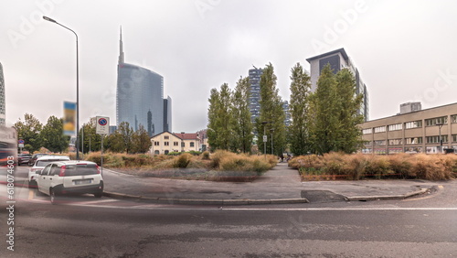 Panorama showing skyscrapers and towers from park with green lawn timelapse in Milan © neiezhmakov