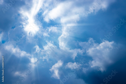 Sunbeam through the cloud on blue sky © kaisorn