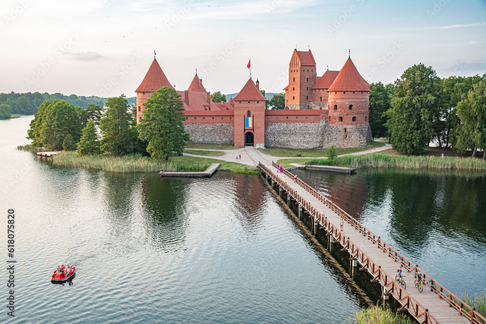 Hot Air Balloon Flight over Trakai. Medieval castle of Trakai, Vilnius, Lithuania, Eastern Europe, surrounded by beautiful islands, lakes, forests, wilderness, nature in summer at sunset, aerial view