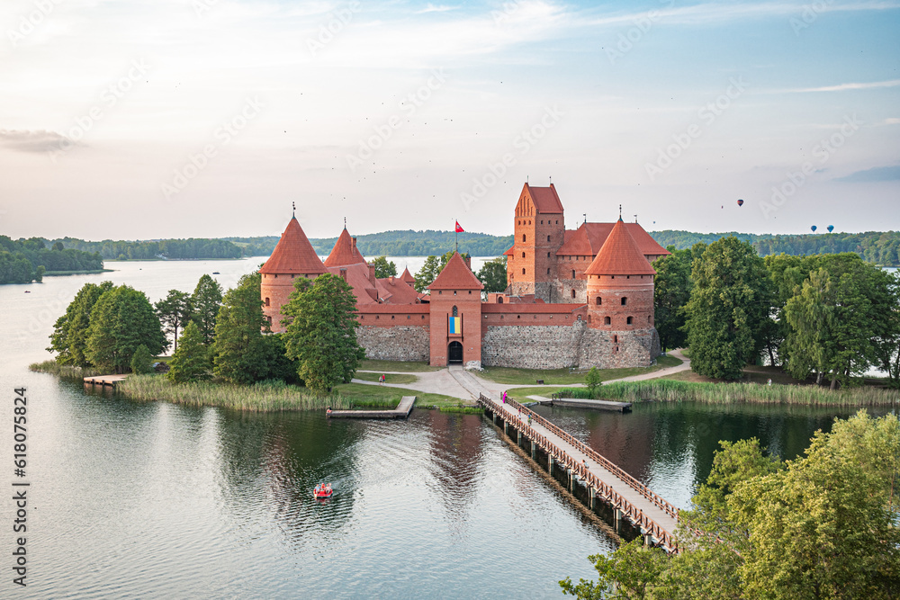 Hot Air Balloon Flight over Trakai. Medieval castle of Trakai, Vilnius, Lithuania, Eastern Europe, surrounded by beautiful islands, lakes, forests, wilderness, nature in summer at sunset, aerial view