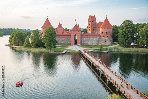 Hot Air Balloon Flight over Trakai. Medieval castle of Trakai, Vilnius, Lithuania, Eastern Europe, surrounded by beautiful islands, lakes, forests, wilderness, nature in summer at sunset, aerial view © Michele Ursi