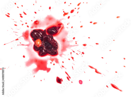 Squashed ripe sour cherry in the puddle of red juice isolated on white