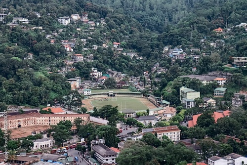 the view from a helicopter over a city with hills and a river © Gimhan Wanasinghe/Wirestock Creators