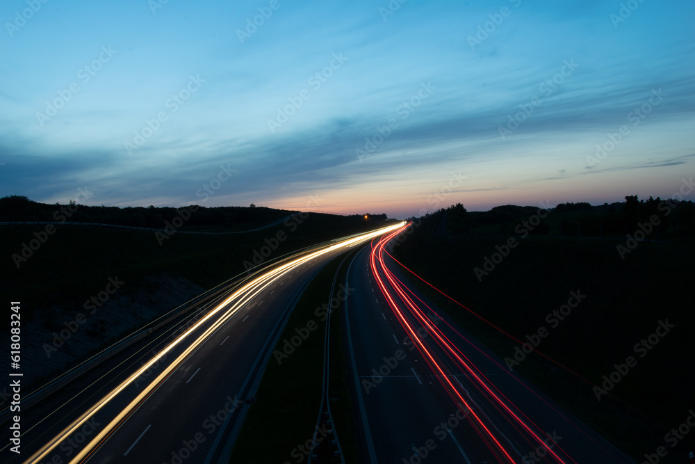 lights of cars driving at night. long exposure