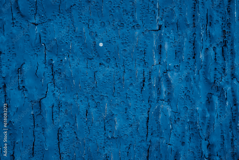 old cracked wood painted blue. background or texture