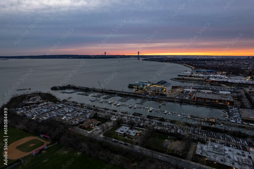 Aerial view over the industrial area on the shores of Gravesend Bay, at sunset in Brooklyn, New York