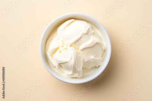 Top view of delicious vanilla milk ice cream in a round white vase isolated on a light pastel orange background. Copy space for text. Generative AI photo.