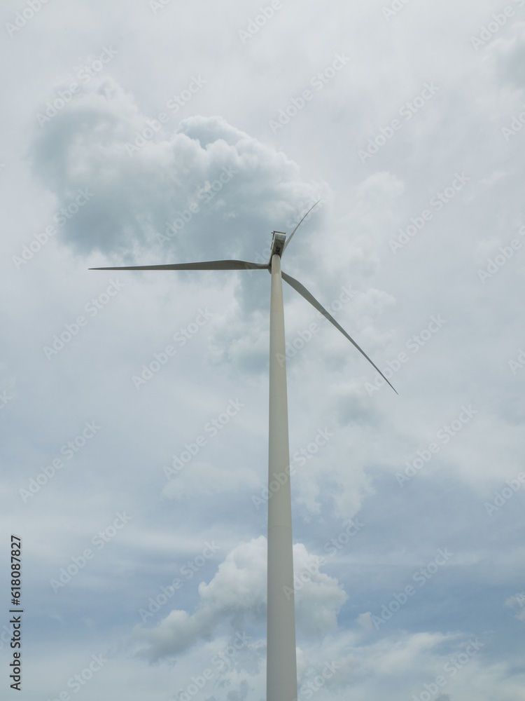wind turbine Innovation for clean energy. tracking shot of energy producing wind turbines in a field a rural area. wind electricity generator in summer fields, power plant, wind efficiency wind turbine Innovation for clean energy. tracking shot of energy producing wind turbines in a field a rural area. wind electricity generator in summer fields, power plant, wind efficiency