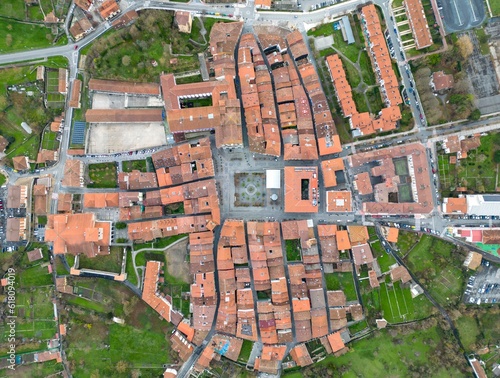 Aerial top view of orange roofs of houses in a village in Basque Country