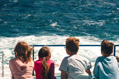 Fototapeta Naklejka Na Ścianę i Meble -  School camp children enjoy seaside adventure - Adriatic sea tide on Croatia island Mali Lošinj in Kvarner Bay