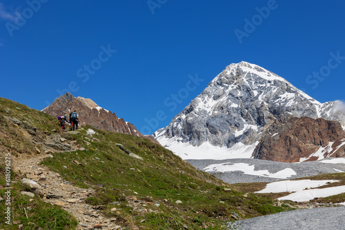 hikers ascending towards Gran Zebrù in Valtellina, Italy
