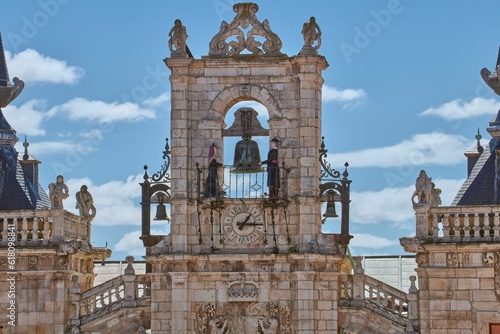 Obraz na plátně Maragato Colas and Maragata Colasa chiming the clock on top of the town hall of