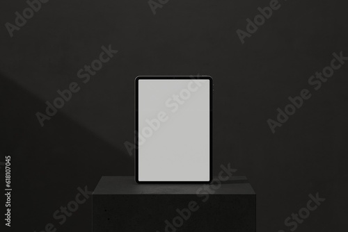 Tablet on black block (ID: 618107045)
