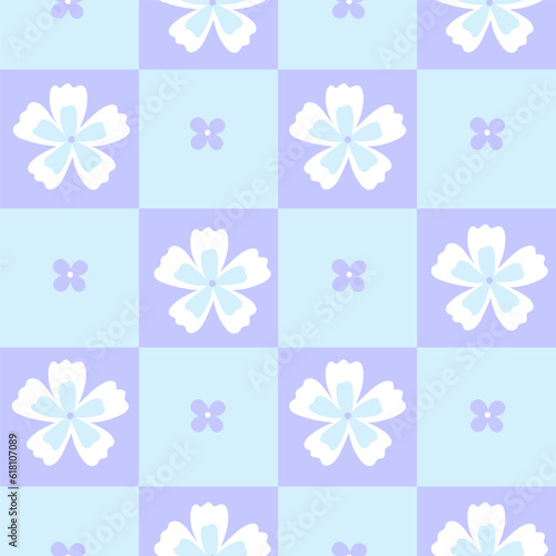 Cute checkered seamless pattern with flowers in a blue colors. Vector graphics.