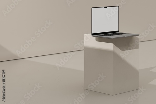 Laptop on beige block (ID: 618107497)