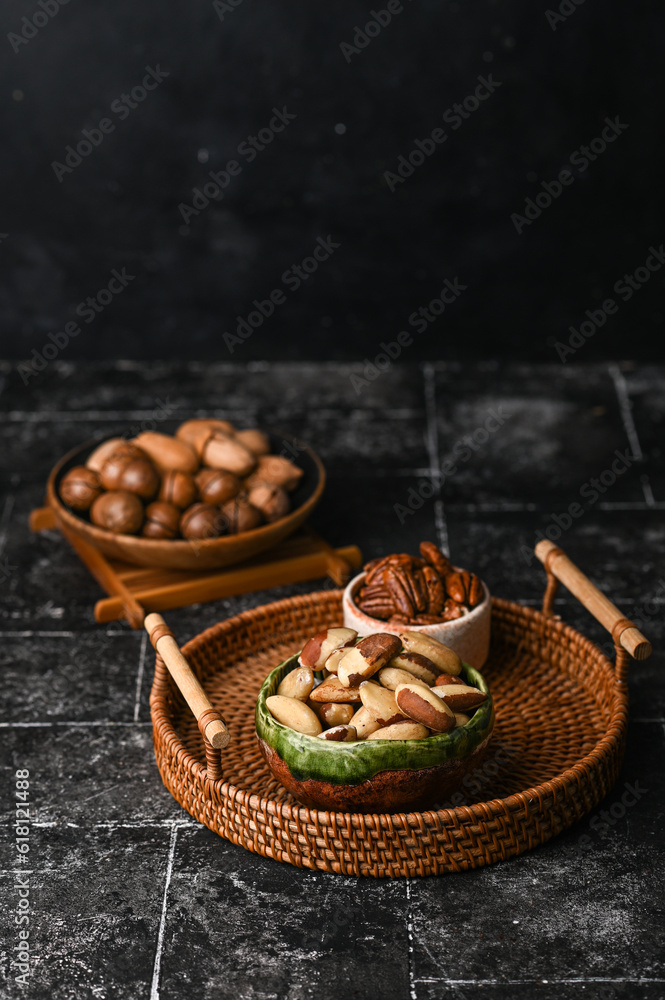Various Nuts in wooden bowl on dark background. Various Nuts in wooden bowl on dark background.