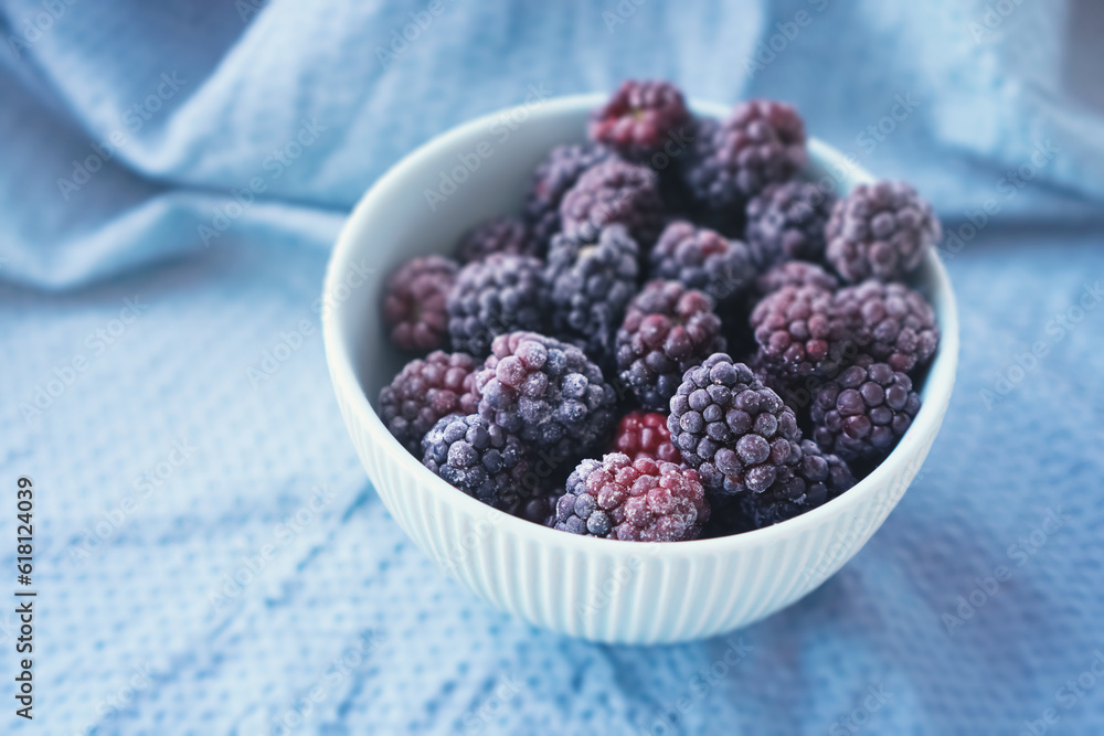 Frozen berries on a light blue ceramic bowl. Ingredients for future culinary recipe. The concept of conscious consumption. Freezing for good eating habits any time of year Frozen berries on a light blue ceramic bowl. Ingredients for future culinary recipe. The concept of conscious consumption. Freezing for good eating habits any time of year