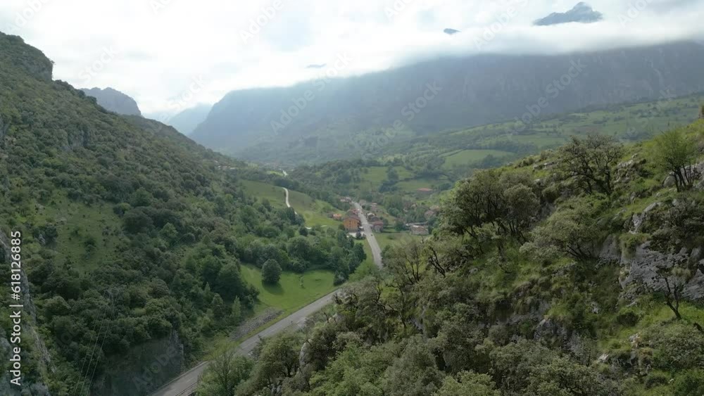 Mountains and village in the North of Spain, Picos de Europa, drone with road Mountains and village in the North of Spain, Picos de Europa, drone with road