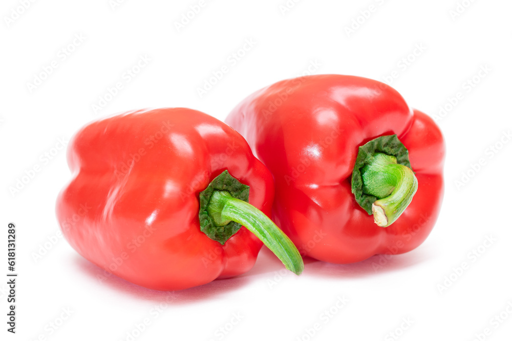 Two Fresh Red Sweet Bell Peppers Isolated on White Background Two Fresh Red Sweet Bell Peppers Isolated on White Background