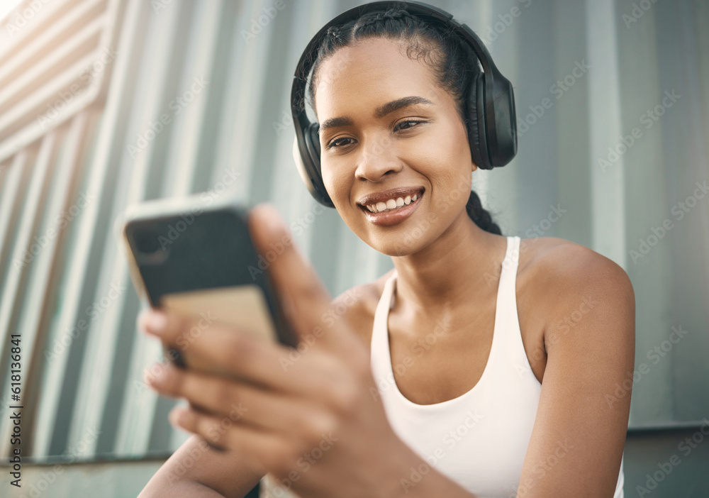 Fitness, phone or happy girl on social media in city listening to music or  radio on