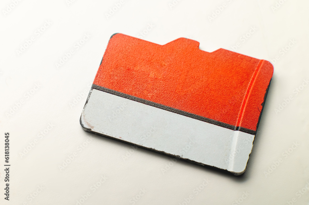 Micro SD memory card on a white background. close-up, top view. Color map in white and red coloring Micro SD memory card on a white background. close-up, top view. Color map in white and red coloring