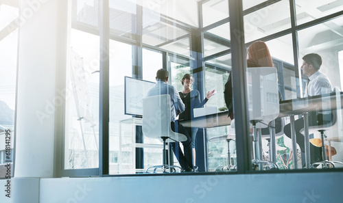 Training, education or business people in presentation for sales report or financial analysis in office. Teaching, leadership or manager planning in a meeting on screen monitor in mentorship coaching