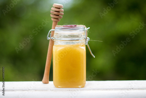 honey in jar with honey spoon
