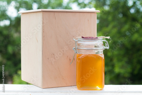 honey in a jar with wooden box