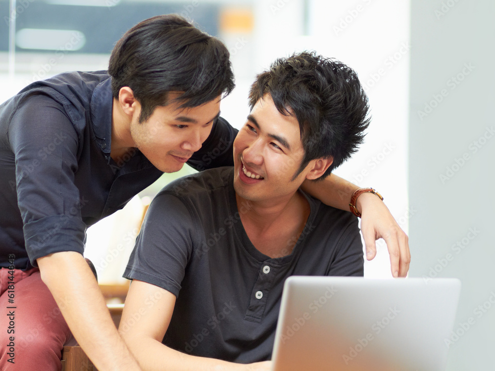 Teamwork, gay couple working with laptop and at their home together happy. Collaboration or partnership, cheerful or happiness and bisexual people with computer for social networking or connectivity Teamwork, gay couple working with laptop and at their home together happy. Collaboration or partnership, cheerful or happiness and bisexual people with computer for social networking or connectivity